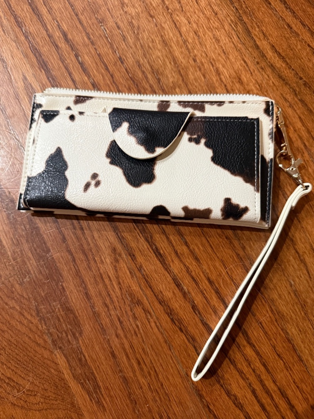 Jen & Co Slim wristlet style wallet in a trendy cow print